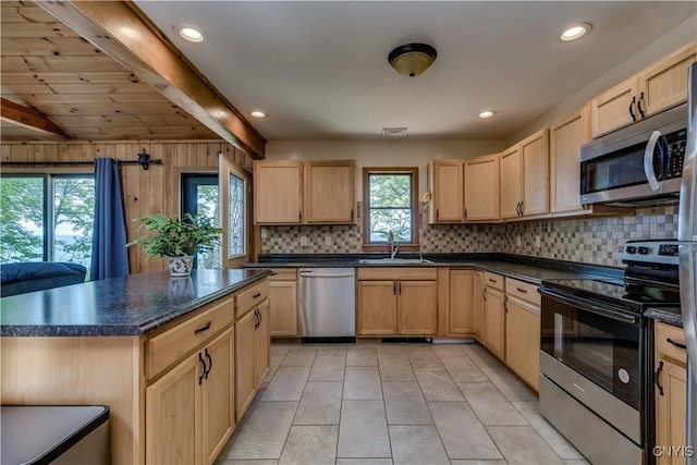 4859 Becker Ln, Lyme, NY 13693 - kitchen with appliances with stainless steel finishes, light brown cabinets, a sink, dark countertops, and beam ceiling
