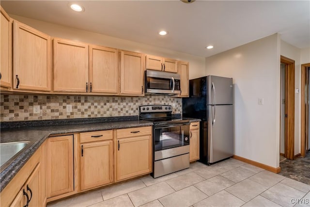 4859 Becker Ln, Lyme, NY 13693 - kitchen with appliances with stainless steel finishes, light brown cabinets, tasteful backsplash, dark countertops, and light tile patterned floors