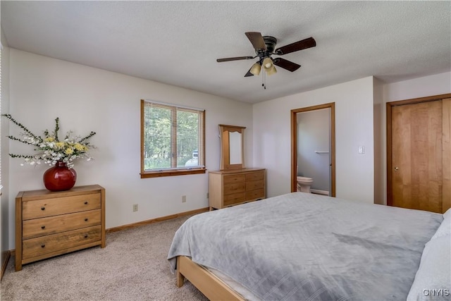 4859 Becker Ln, Lyme, NY 13693 - bedroom featuring carpet flooring, baseboards, ensuite bath, and ceiling fan