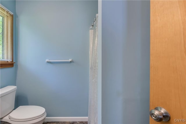 4859 Becker Ln, Lyme, NY 13693 - full bath with toilet, baseboards, and a shower with shower curtain