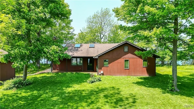 4859 Becker Ln, Lyme, NY 13693 - rear view of property with a yard and roof with shingles