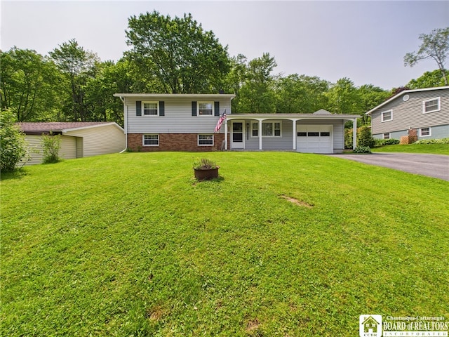32 Parkview Ave, Bradford-City, PA 16701 - tri-level home featuring a garage, driveway, a front yard, and view of scattered trees