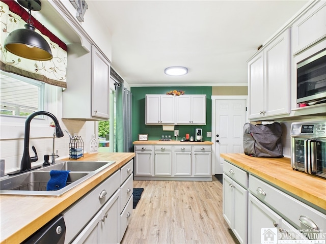 32 Parkview Ave, Bradford-City, PA 16701 - kitchen featuring wooden counters, a sink, light wood finished floors, ornamental molding, and backsplash