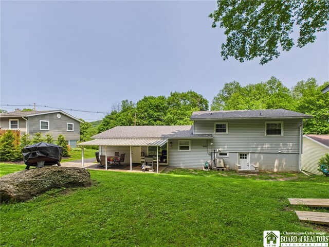 32 Parkview Ave, Bradford-City, PA 16701 - rear view of property featuring a patio area, a yard, and a shingled roof