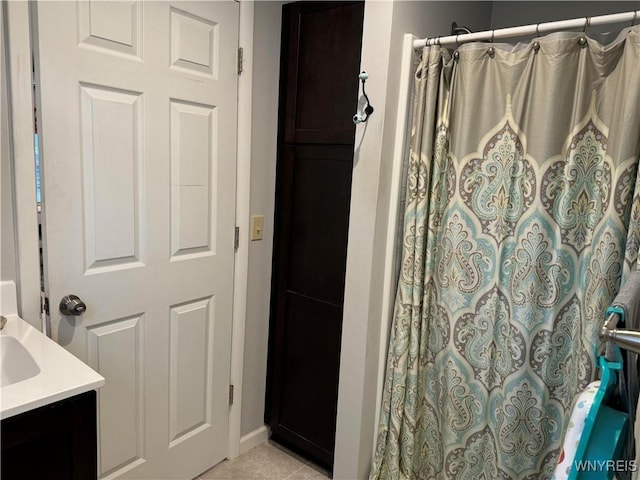 130 S 6th St, Olean-City, NY 14760 - bathroom with a shower with shower curtain, vanity, baseboards, and tile patterned floors