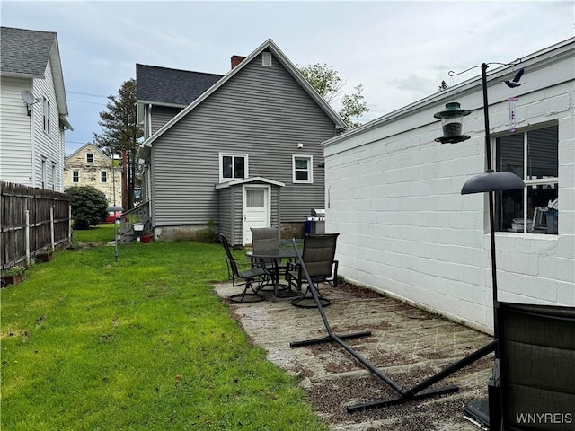 130 S 6th St, Olean-City, NY 14760 - rear view of house with a chimney and a patio