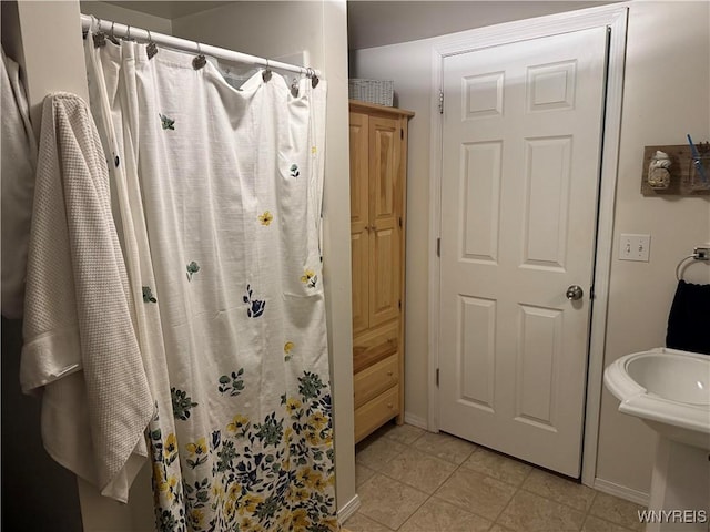 130 S 6th St, Olean-City, NY 14760 - full bath with a shower with shower curtain, baseboards, and tile patterned floors