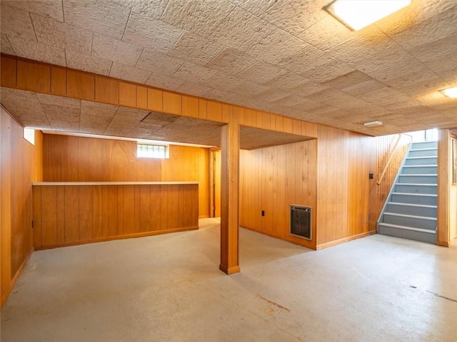 257 Longridge Ave, Greece, NY 14616 - basement featuring stairway, wooden walls, baseboards, and heating unit