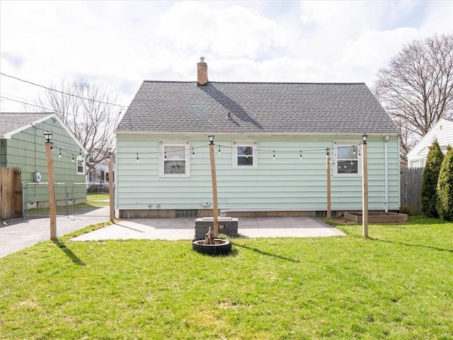 257 Longridge Ave, Greece, NY 14616 - back of property with a patio, a chimney, and roof with shingles