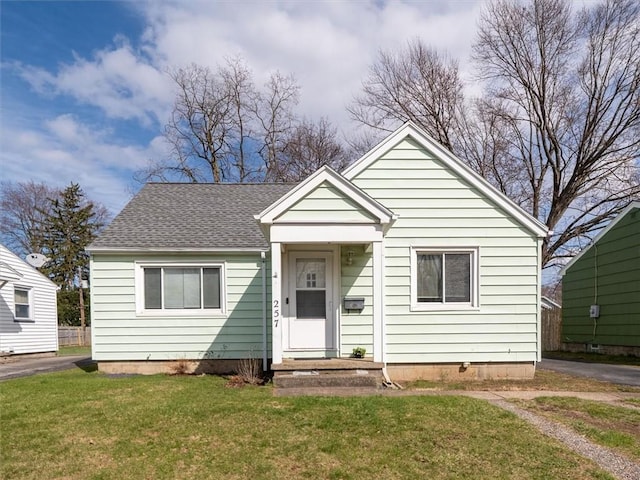 257 Longridge Ave, Greece, NY 14616 - bungalow with a front lawn and a shingled roof