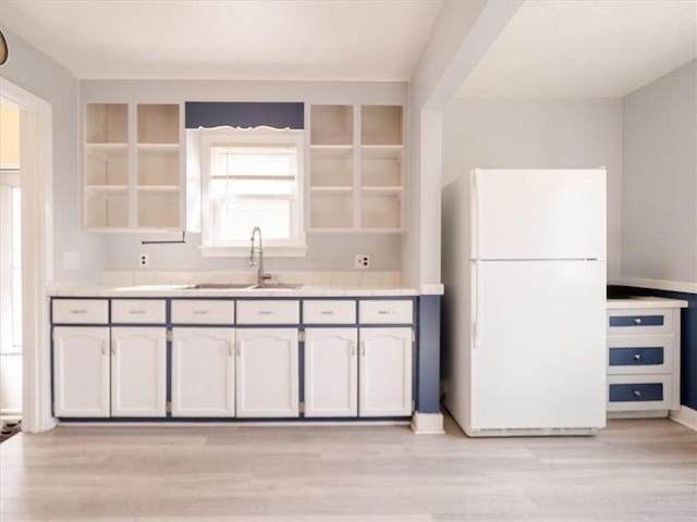 257 Longridge Ave, Greece, NY 14616 - kitchen with freestanding refrigerator, a sink, open shelves, light wood-type flooring, and light countertops