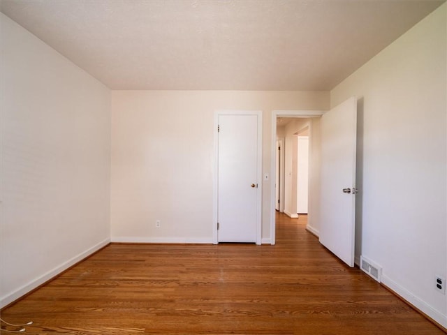 257 Longridge Ave, Greece, NY 14616 - empty room with wood finished floors and baseboards