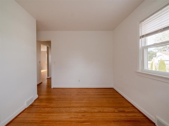 257 Longridge Ave, Greece, NY 14616 - empty room with light wood-style floors and baseboards
