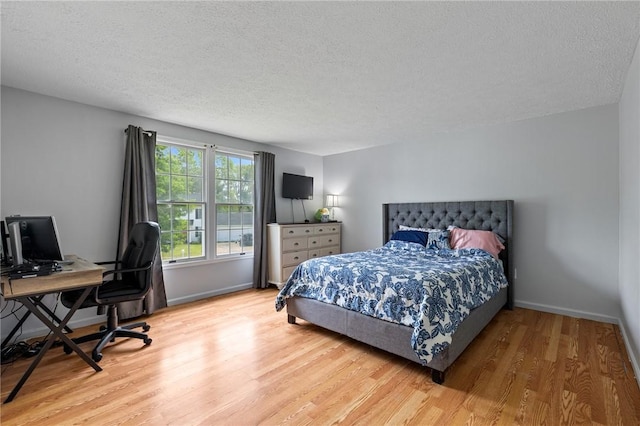 11 Shadow Ln, Gates, NY 14606 - bedroom with wood finished floors, a textured ceiling, an office area, and baseboards