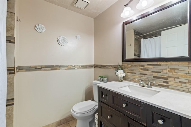 11 Shadow Ln, Gates, NY 14606 - full bathroom with toilet, vanity, tile patterned floors, decorative backsplash, and a textured ceiling