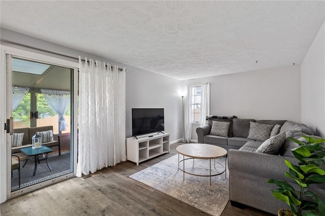 11 Shadow Ln, Gates, NY 14606 - living area with a textured ceiling, wood finished floors, and french doors