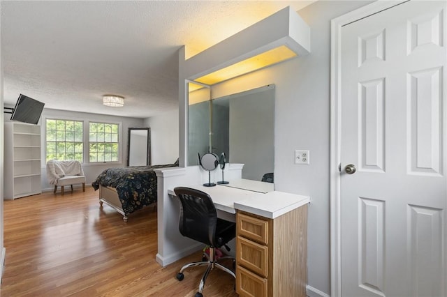 11 Shadow Ln, Gates, NY 14606 - office with light wood-style flooring, baseboards, and a textured ceiling