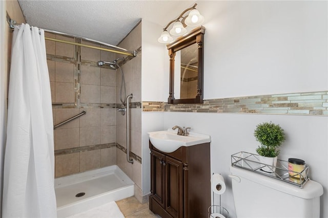 11 Shadow Ln, Gates, NY 14606 - full bathroom featuring toilet, vanity, a tile shower, tile patterned flooring, and a textured ceiling