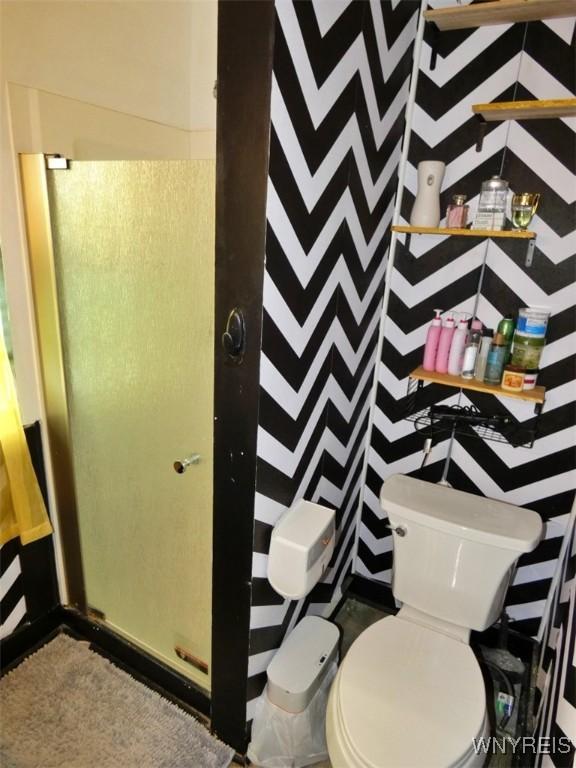 1862 Kenmore Ave, Buffalo, NY 14216 - bathroom with a shower with shower curtain and toilet
