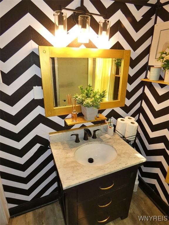 1862 Kenmore Ave, Buffalo, NY 14216 - bathroom with wood finished floors and vanity