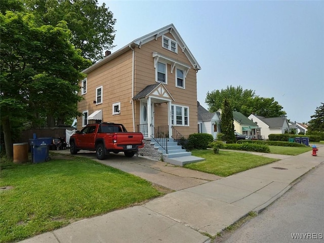 1862 Kenmore Ave, Buffalo, NY 14216 - view of front facade featuring a front lawn and driveway