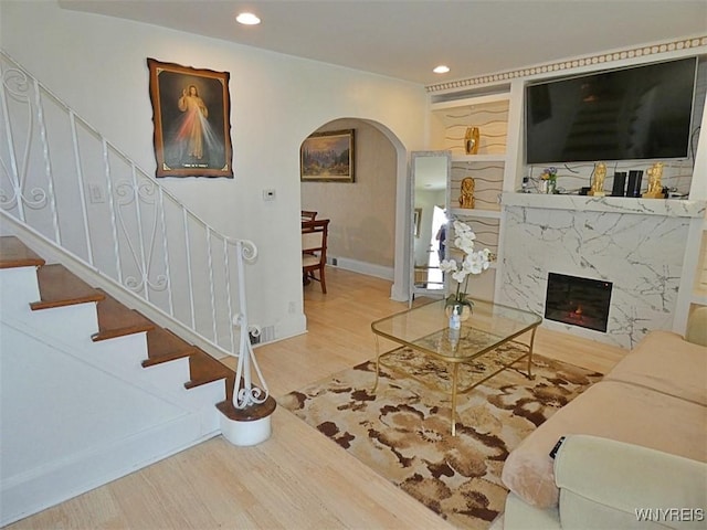 1862 Kenmore Ave, Buffalo, NY 14216 - living room with arched walkways, wood finished floors, stairs, recessed lighting, and baseboards