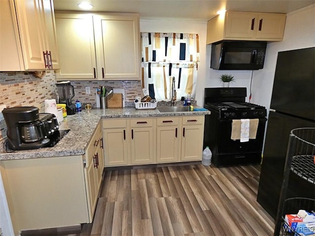 1862 Kenmore Ave, Buffalo, NY 14216 - kitchen featuring black appliances, decorative backsplash, wood finished floors, and a sink