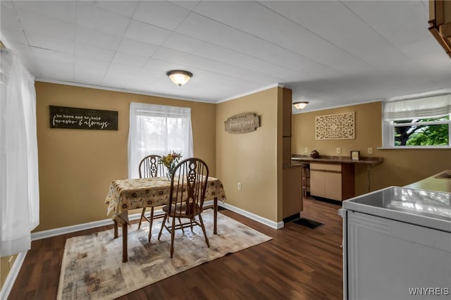 7228 Rapids Rd, Lockport-Town, NY 14094 - dining area with dark wood-style floors, baseboards, and ornamental molding