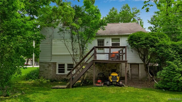 7228 Rapids Rd, Lockport-Town, NY 14094 - back of property featuring stairway, a yard, and a wooden deck