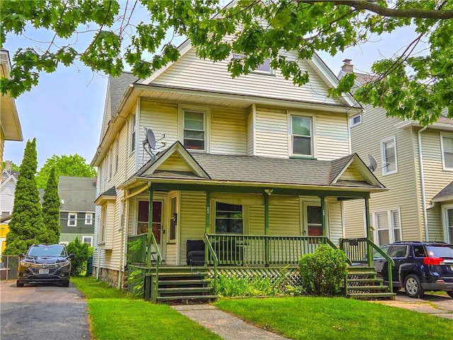 40 Grover St, Rochester, NY 14611 - view of front of house with covered porch and a front yard
