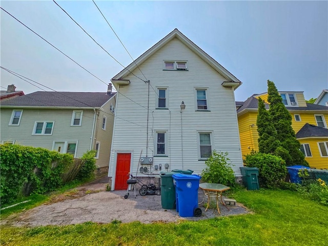 40 Grover St, Rochester, NY 14611 - rear view of property with a lawn and a patio area