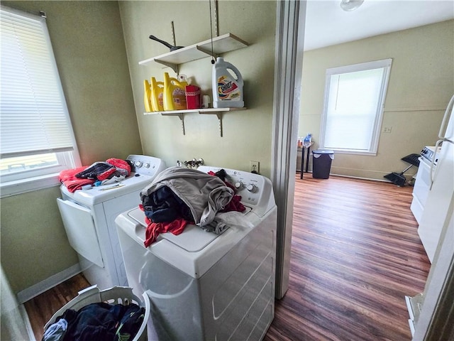 40 Grover St, Rochester, NY 14611 - washroom with washer and dryer, healthy amount of natural light, wood finished floors, and baseboards