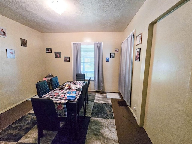 40 Grover St, Rochester, NY 14611 - dining area with a textured ceiling and baseboards