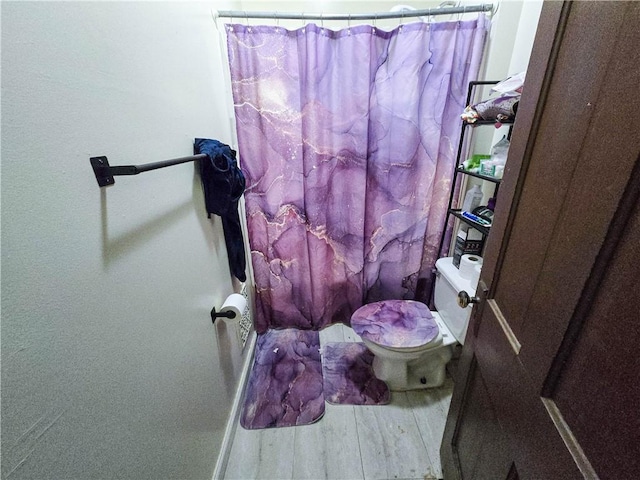 40 Grover St, Rochester, NY 14611 - full bathroom featuring toilet, curtained shower, and wood finished floors