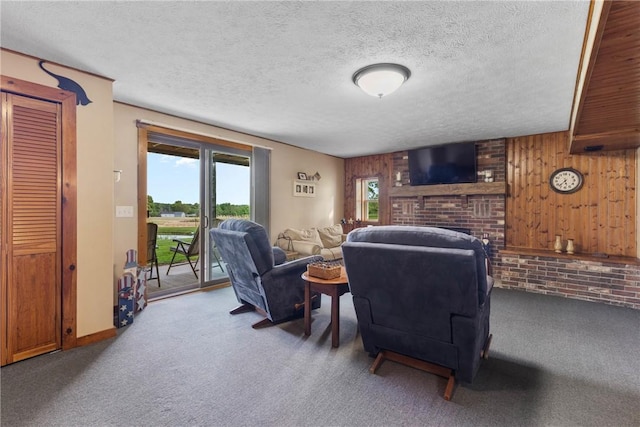 2203 State Route 14 N, Lyons, NY 14489 - carpeted living room featuring a brick fireplace, a textured ceiling, and wooden walls