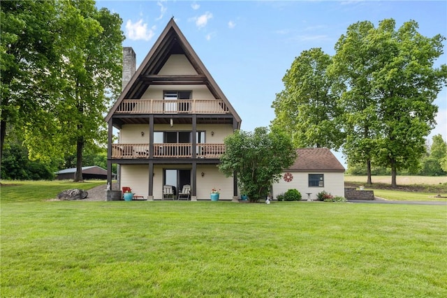 2203 State Route 14 N, Lyons, NY 14489 - rear view of house featuring a yard, a chimney, and a balcony
