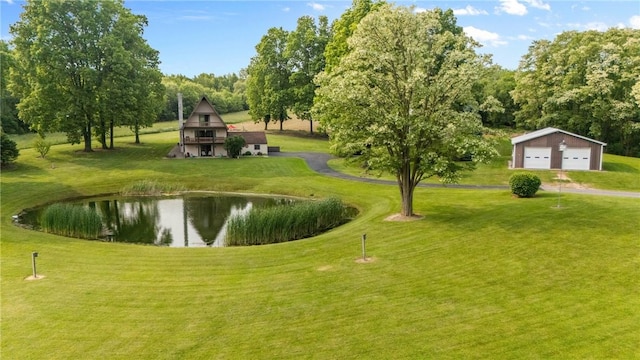 2203 State Route 14 N, Lyons, NY 14489 - view of home's community with a detached garage, a lawn, a water view, and an outdoor structure