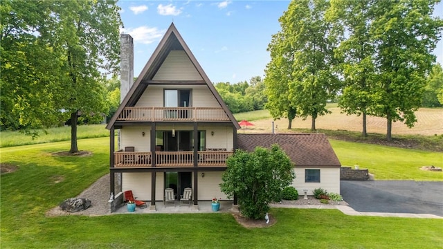 2203 State Route 14 N, Lyons, NY 14489 - rear view of property with a patio, a chimney, and a yard