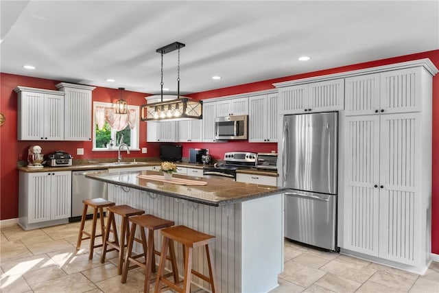 2203 State Route 14 N, Lyons, NY 14489 - kitchen featuring appliances with stainless steel finishes, a breakfast bar area, a sink, a center island, and recessed lighting