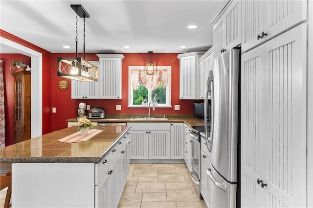 2203 State Route 14 N, Lyons, NY 14489 - kitchen with appliances with stainless steel finishes, a sink, recessed lighting, a center island, and white cabinetry
