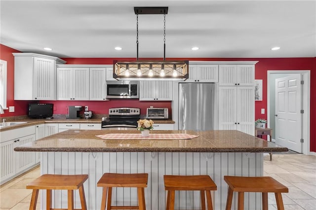 2203 State Route 14 N, Lyons, NY 14489 - kitchen featuring stainless steel appliances, a sink, a center island, white cabinetry, and recessed lighting