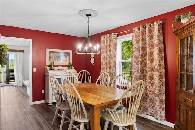 2203 State Route 14 N, Lyons, NY 14489 - dining area featuring dark wood-style flooring, plenty of natural light, a chandelier, and baseboards
