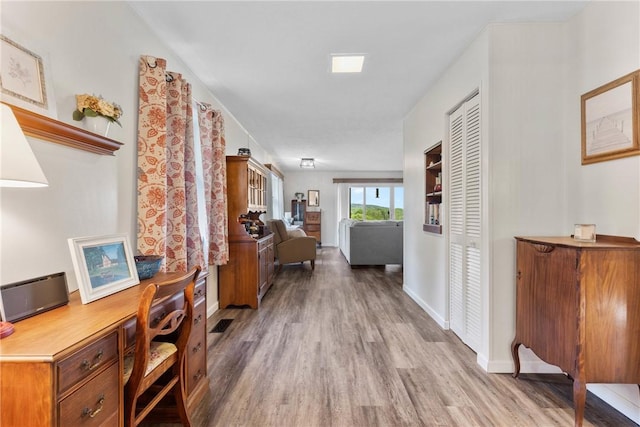 2203 State Route 14 N, Lyons, NY 14489 - hall featuring wood finished floors, an office area, and baseboards