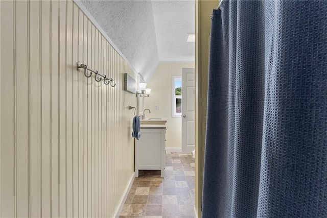 2203 State Route 14 N, Lyons, NY 14489 - hall with stone finish floors, baseboards, and a textured ceiling