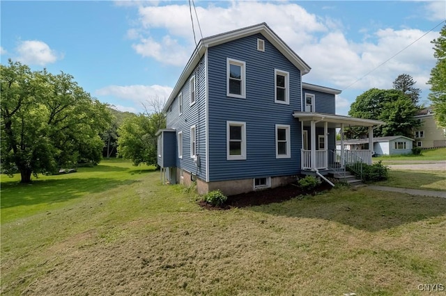 2630 E Main St, Ira, NY 13033 - view of side of home featuring a yard and covered porch