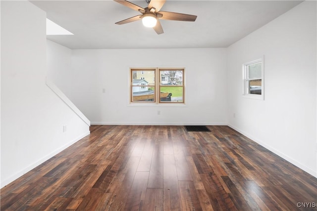 2630 E Main St, Ira, NY 13033 - unfurnished room featuring a ceiling fan, dark wood-type flooring, and baseboards