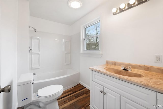 2630 E Main St, Ira, NY 13033 - bathroom with toilet, vanity, wood finished floors, baseboards, and washtub / shower combination