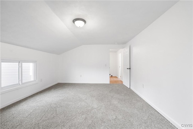 2630 E Main St, Ira, NY 13033 - additional living space with vaulted ceiling, carpet floors, and baseboards