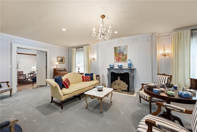 88 Middlesex Rd, Buffalo, NY 14216 - living room featuring ornamental molding, a decorative wall, a chandelier, light colored carpet, and a fireplace