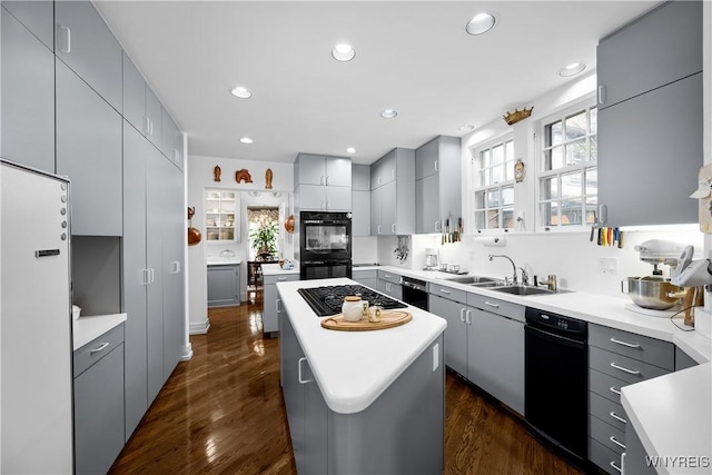 88 Middlesex Rd, Buffalo, NY 14216 - kitchen featuring gray cabinetry, a kitchen island, black appliances, a sink, and dark wood-style floors